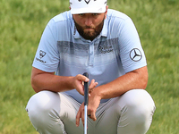 Jon Rahm of Barrika, Spain lines up his putt on the 18th green during The Memorial Tournament presented by Workday at Muirfield Village Golf...