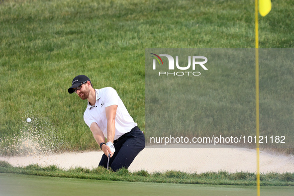 Patrick Rodgers of Jupiter, Florida hits from the bunker at the18th green during The Memorial Tournament presented by Workday at Muirfield V...