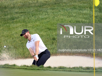 Patrick Rodgers of Jupiter, Florida hits from the bunker at the18th green during The Memorial Tournament presented by Workday at Muirfield V...