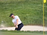 Patrick Rodgers of Jupiter, Florida hits from the bunker at the18th green during The Memorial Tournament presented by Workday at Muirfield V...