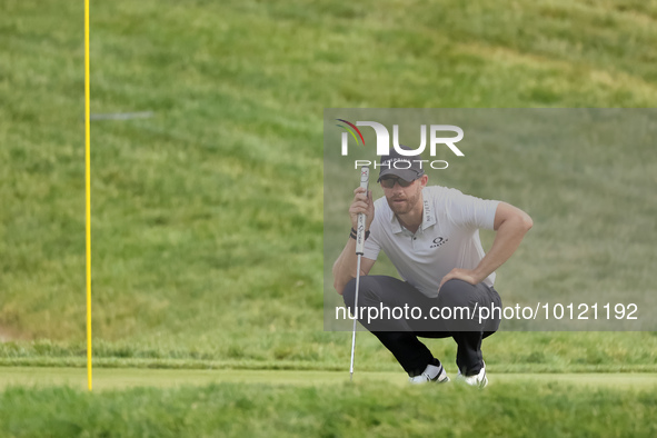 Patrick Rodgers of Jupiter, Florida lines up his putt on the 1th green during The Memorial Tournament presented by Workday at Muirfield Vill...