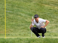 Patrick Rodgers of Jupiter, Florida lines up his putt on the 1th green during The Memorial Tournament presented by Workday at Muirfield Vill...