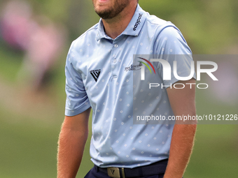 Patrick Rodgers of Jupiter, Florida reacts to his shot from the 18th fairway during The Memorial Tournament presented by Workday at Muirfiel...