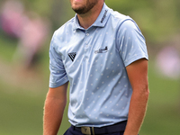 Patrick Rodgers of Jupiter, Florida reacts to his shot from the 18th fairway during The Memorial Tournament presented by Workday at Muirfiel...