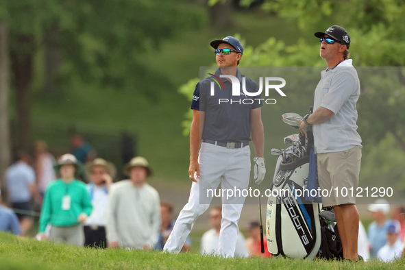 Rickie Fowler of Murrieta, California follows his shot from the bunker on the 18th fairway during The Memorial Tournament presented by Workd...