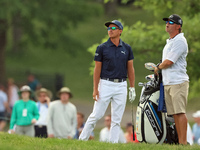 Rickie Fowler of Murrieta, California follows his shot from the bunker on the 18th fairway during The Memorial Tournament presented by Workd...