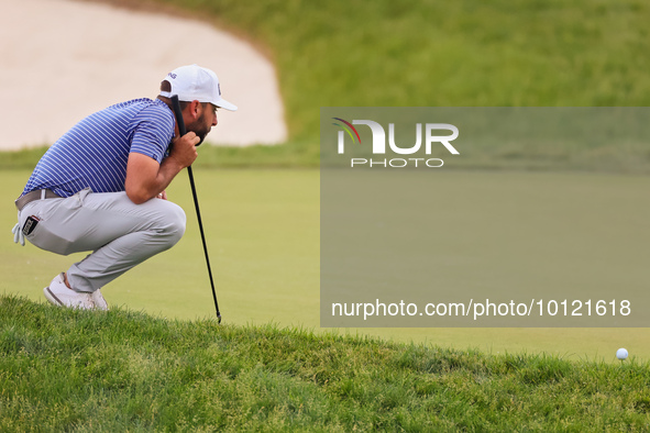 Stephan Jaeger of Germany lines up his putt on the 18th green during The Memorial Tournament presented by Workday at Muirfield Village Golf...