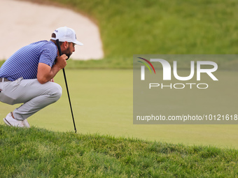 Stephan Jaeger of Germany lines up his putt on the 18th green during The Memorial Tournament presented by Workday at Muirfield Village Golf...