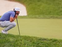 Stephan Jaeger of Germany lines up his putt on the 18th green during The Memorial Tournament presented by Workday at Muirfield Village Golf...