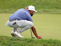 Stephan Jaeger of Germany places his ball on the 18th green during The Memorial Tournament presented by Workday at Muirfield Village Golf Cl...