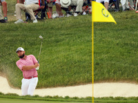 Terrell Hatton of High Wycombe, England hits from the bunker on the 18th green during The Memorial Tournament presented by Workday at Muirfi...