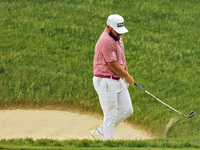 Tyrrell Hatton of High Wycombe, England reacts to his shot from the bunker on the 18th green during The Memorial Tournament presented by Wor...