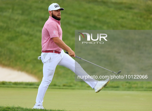 Tyrrell Hatton of High Wycombe, England reacts to his putt on the 18th green during The Memorial Tournament presented by Workday at Muirfiel...