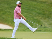 Tyrrell Hatton of High Wycombe, England reacts to his putt on the 18th green during The Memorial Tournament presented by Workday at Muirfiel...