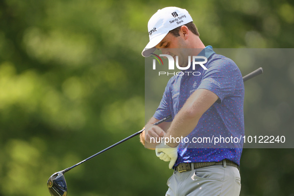 Denny McCarthy of Jupiter, Florida puts on his glove at the 18th tee during The Memorial Tournament presented by Workday at Muirfield Villag...