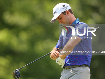 Denny McCarthy of Jupiter, Florida puts on his glove at the 18th tee during The Memorial Tournament presented by Workday at Muirfield Villag...