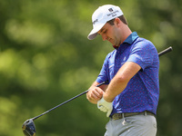 Denny McCarthy of Jupiter, Florida puts on his glove at the 18th tee during The Memorial Tournament presented by Workday at Muirfield Villag...