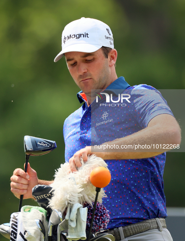 Denny McCarthy of Jupiter, Florida pulls out his club at the 18th tee during The Memorial Tournament presented by Workday at Muirfield Villa...