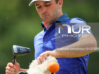 Denny McCarthy of Jupiter, Florida pulls out his club at the 18th tee during The Memorial Tournament presented by Workday at Muirfield Villa...