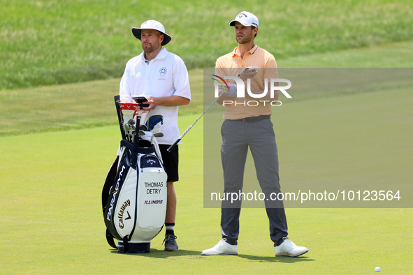 Thomas Detry of Brussels, Belgium takes his club on the 17th fairway during The Memorial Tournament presented by Workday at Muirfield Villag...