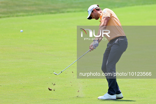 Thomas Detry of Brussels, Belgium hits from the 17th fairway during The Memorial Tournament presented by Workday at Muirfield Village Golf C...