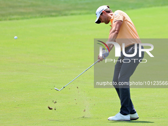 Thomas Detry of Brussels, Belgium hits from the 17th fairway during The Memorial Tournament presented by Workday at Muirfield Village Golf C...