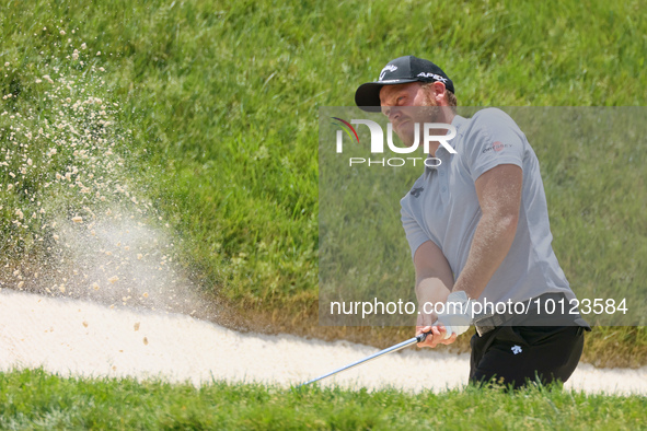 Danny Willett of Sheffield, England hits from the bunker on the 17th green during The Memorial Tournament presented by Workday at Muirfield...