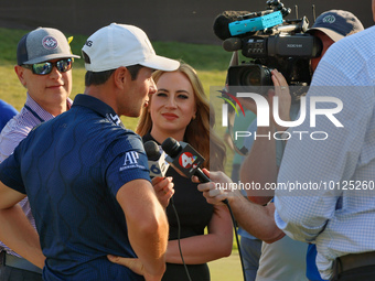 Viktor Hovland of Oslo, Norway is interviewed after winning in a playoff against Denny McCarthy of Jupiter, Florida during the final round o...