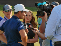 Viktor Hovland of Oslo, Norway is interviewed after winning in a playoff against Denny McCarthy of Jupiter, Florida during the final round o...