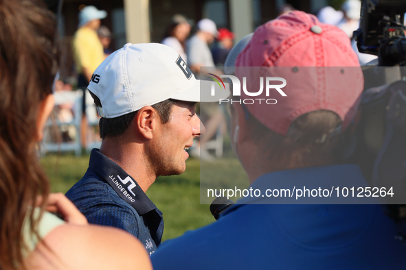 Viktor Hovland of Oslo, Norway is interviewed after winning in a playoff against Denny McCarthy of Jupiter, Florida during the final round o...