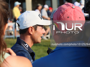 Viktor Hovland of Oslo, Norway is interviewed after winning in a playoff against Denny McCarthy of Jupiter, Florida during the final round o...