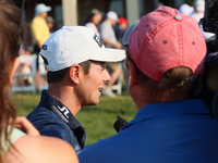 Viktor Hovland of Oslo, Norway is interviewed after winning in a playoff against Denny McCarthy of Jupiter, Florida during the final round o...