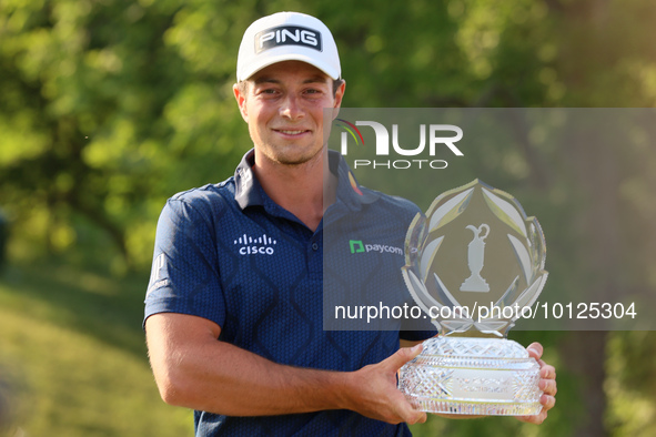 Viktor Hovland of Oslo, Norway holds the winner’s trophy after winning his first tournament in the United States in a playoff against Denny...