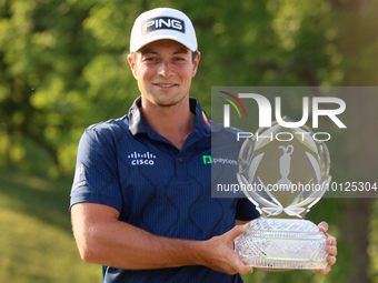 Viktor Hovland of Oslo, Norway holds the winner’s trophy after winning his first tournament in the United States in a playoff against Denny...