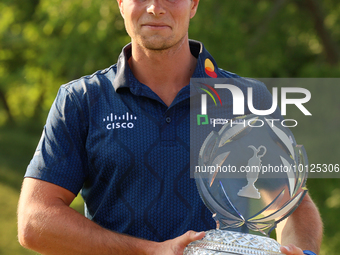 Viktor Hovland of Oslo, Norway holds the winner’s trophy after winning his first tournament in the United States in a playoff against Denny...