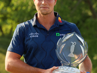 Viktor Hovland of Oslo, Norway holds the winner’s trophy after winning his first tournament in the United States in a playoff against Denny...