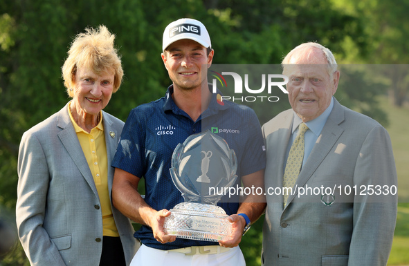 Barbara Niklaus (left) and Jack Nicklaus (right) pose with Viktor Hovland of Oslo, Norway who  holds the winner’s trophy after winning his f...