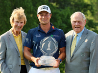 Barbara Niklaus (left) and Jack Nicklaus (right) pose with Viktor Hovland of Oslo, Norway who  holds the winner’s trophy after winning his f...