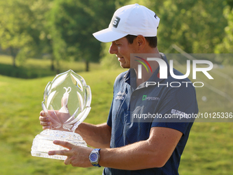 Viktor Hovland of Oslo, Norway holds the winner’s trophy after winning his first tournament in the United States in a playoff against Denny...