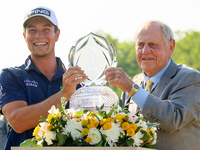 Jack Nicklaus presents the winner’s trophy to Viktor Hovland of Oslo, Norway after he won his first tournament in the United States in a pla...