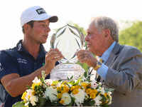 Jack Nicklaus presents the winner’s trophy to Viktor Hovland of Oslo, Norway after he won his first tournament in the United States in a pla...