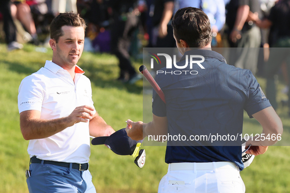 Viktor Hovland of Oslo, Norway greets Denny McCarthy of Jupiter, Florida after he won his first tournament in the United States in a playoff...