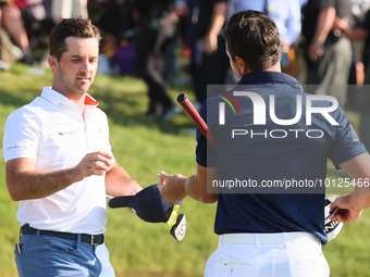 Viktor Hovland of Oslo, Norway greets Denny McCarthy of Jupiter, Florida after he won his first tournament in the United States in a playoff...