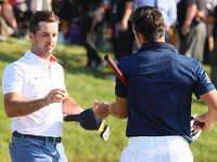 Viktor Hovland of Oslo, Norway greets Denny McCarthy of Jupiter, Florida after he won his first tournament in the United States in a playoff...