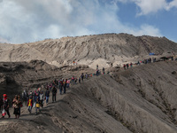 PROBOLINGGO, INDONESIA - JUNE 5: Tenggerese walk and hike carrying agricultural products and livestock to be sacrificed during the Yadnya Ka...