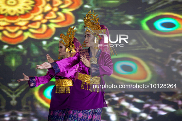 Dancers performing the art of Offering Dance, Batam, Riau Islands. The Offering Dance is a traditional Malay dance that is used to welcome g...