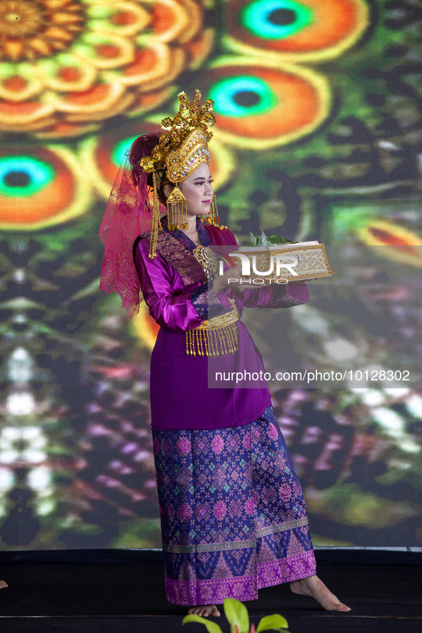 Dancers performing the art of Offering Dance, Batam, Riau Islands. The Offering Dance is a traditional Malay dance that is used to welcome g...