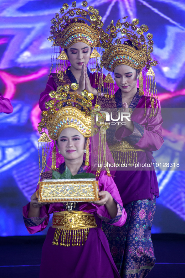 Dancers performing the art of Offering Dance, Batam, Riau Islands. The Offering Dance is a traditional Malay dance that is used to welcome g...