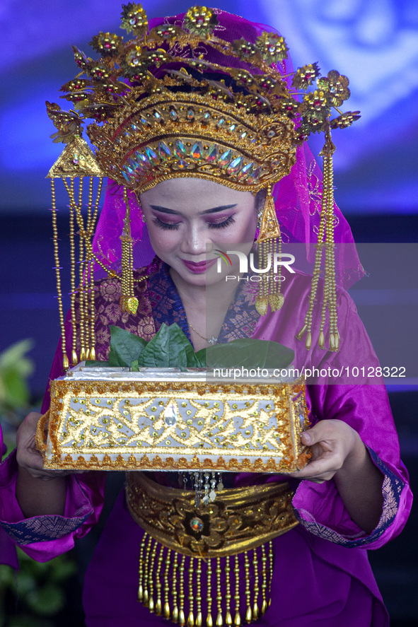 Dancers performing the art of Offering Dance, Batam, Riau Islands. The Offering Dance is a traditional Malay dance that is used to welcome g...