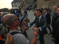 MONT-SAINT-MICHEL, FRANCE - JUNE 05, 2023:   
French President Emmanuel Macron and First Lady Brigitte Macron during their visit to Mont Sai...